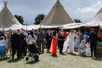 Guests enjoying Alcott Weddings Tipi