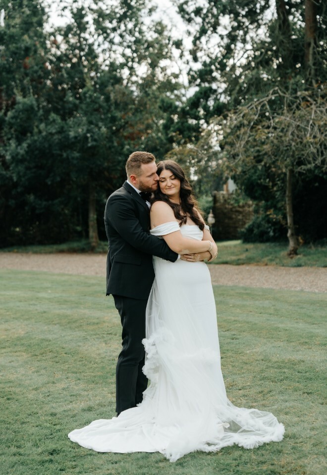 bride and groom hugging
