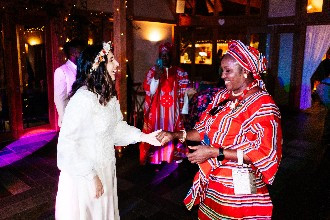 Bride dancing with family in the evening celebrations at The Oak Tree of Peover