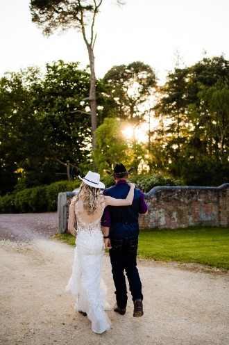 Bride and groom walking away