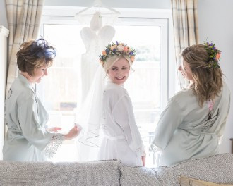 Hannah getting ready with her mum and bridesmaid