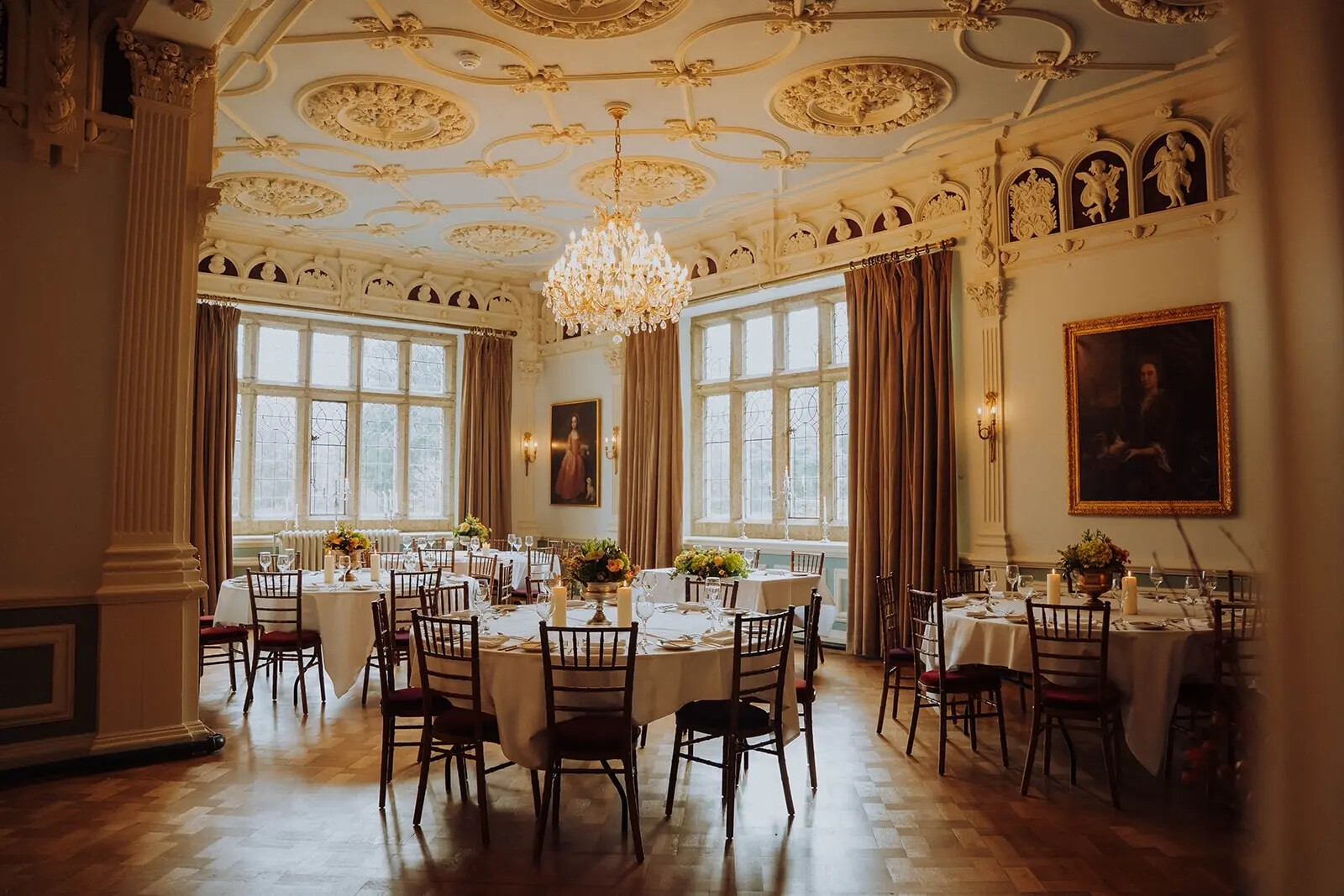Interior of hotel wedding venue, Lewtrenchard Manor Hotel, set for a wedding breakfast