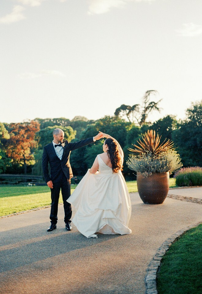 Bride and groom dancing outside at Clevedon Hall