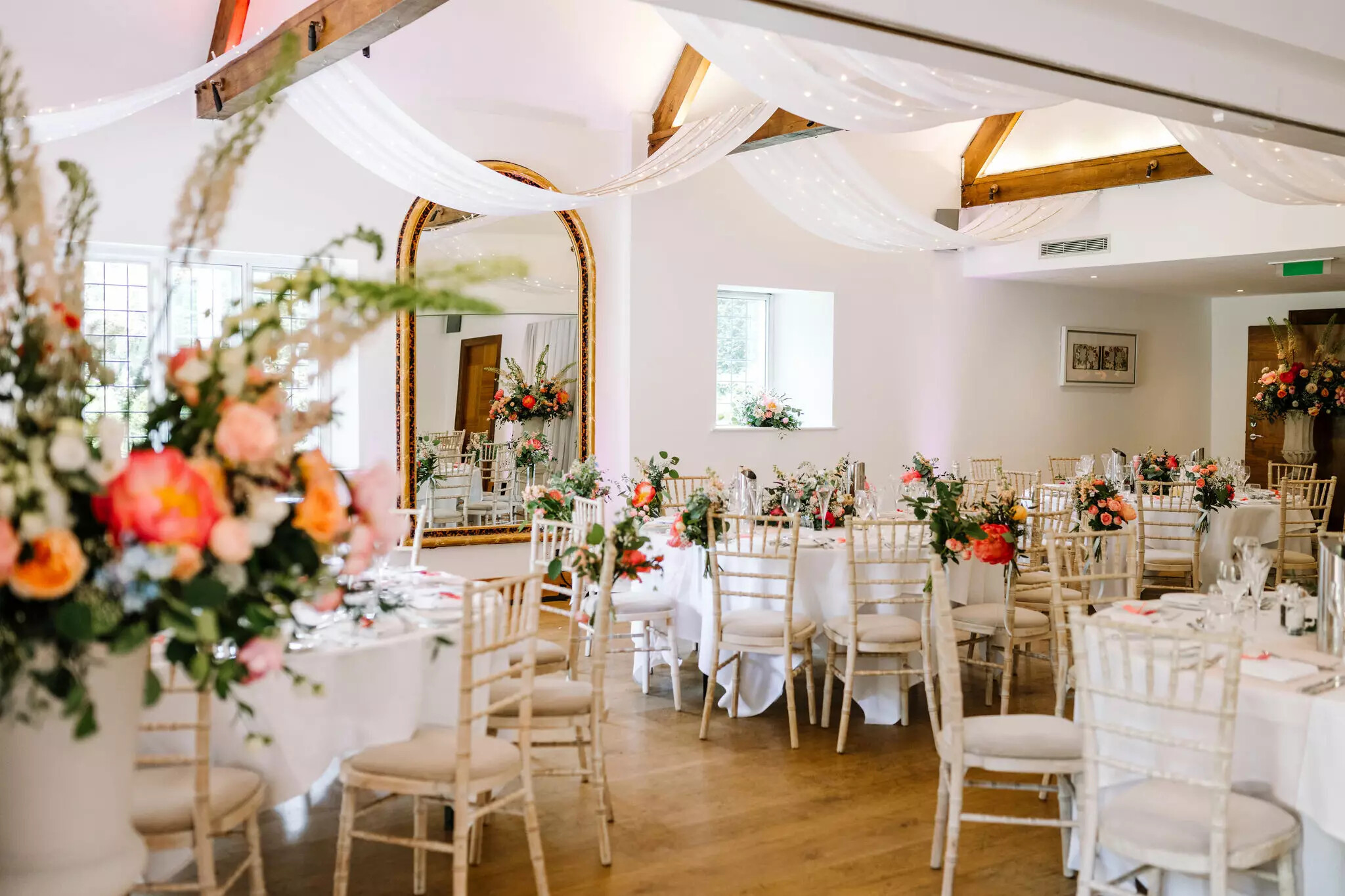 Colourful wedding breakfast setting inside Cotswold House Hotel