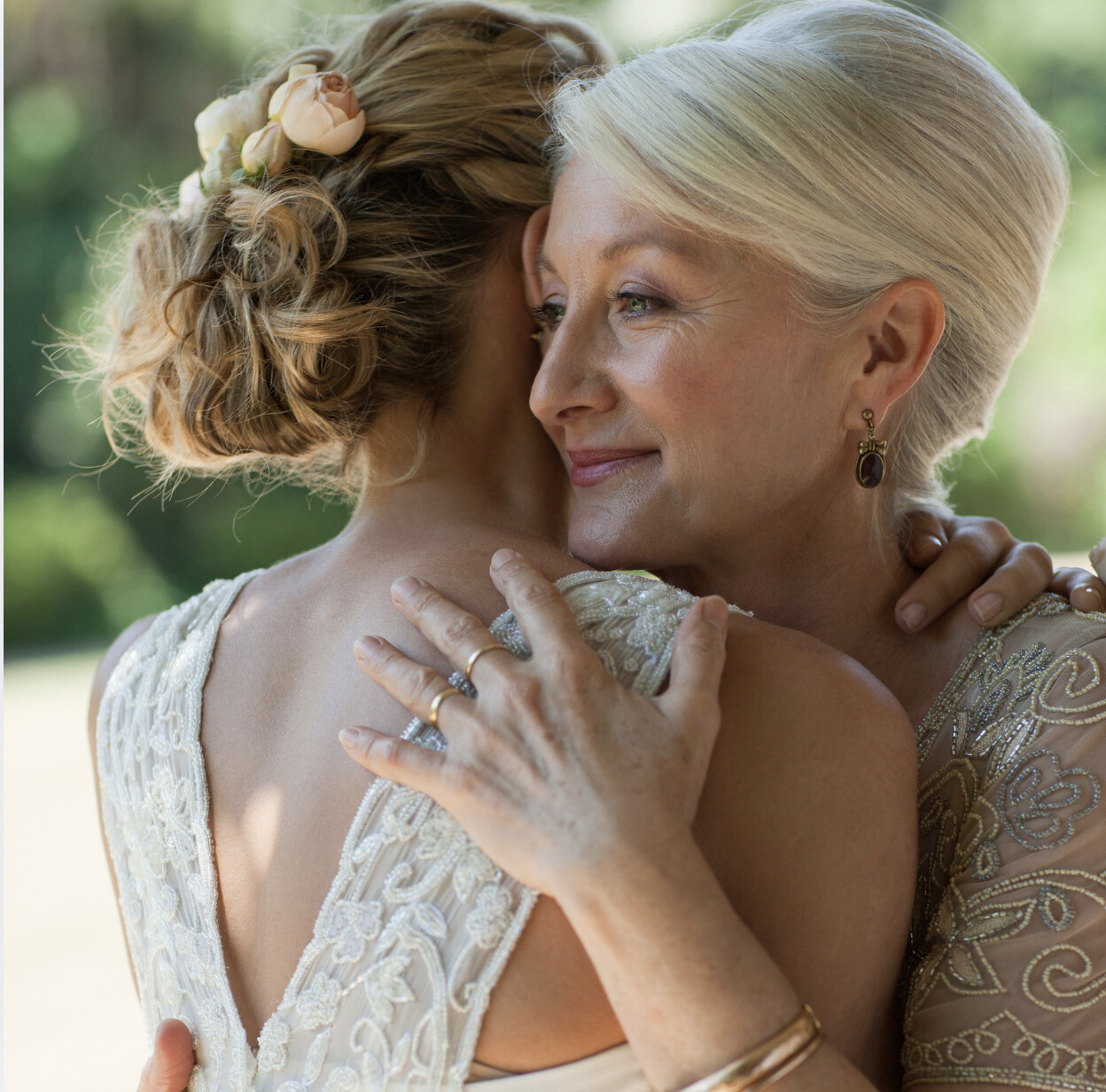 A mother and a bride embracing