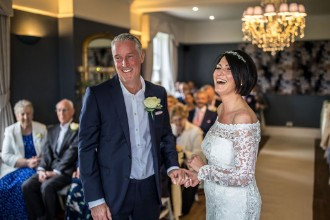 bride and groom laughing