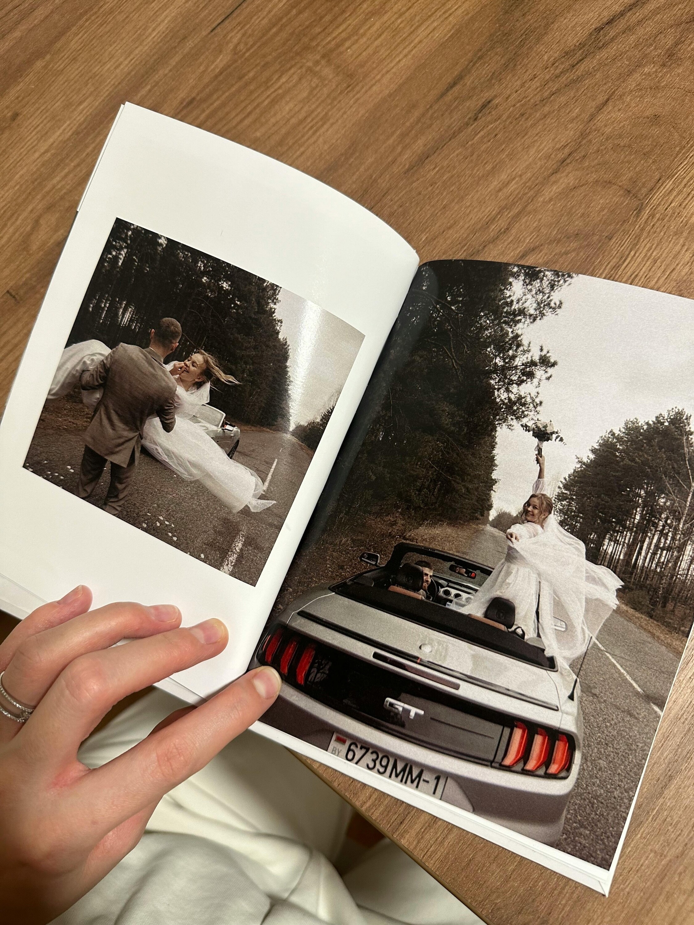 Wedding photo album with printed wedding photography spreads and full-page bridal portraits
