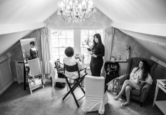 bride and bridesmaids getting ready b&w