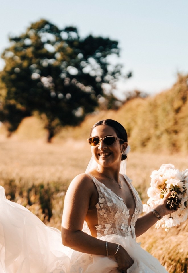 Nathan and Sophie wearing sunglasses and taking photos