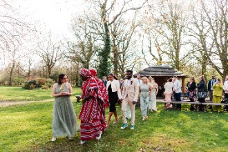 Guests leaving outdoor ceremony at The Oak Tree of Peover