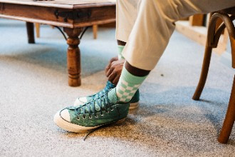 Green converse worn by groom