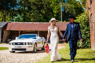bride and groom walking holding hands