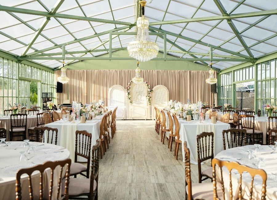 Interior of a wedding venue set for a wedding breakfast