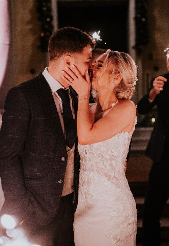 Bride and groom sparkler moment outside Hedsor House Buckinghamshire