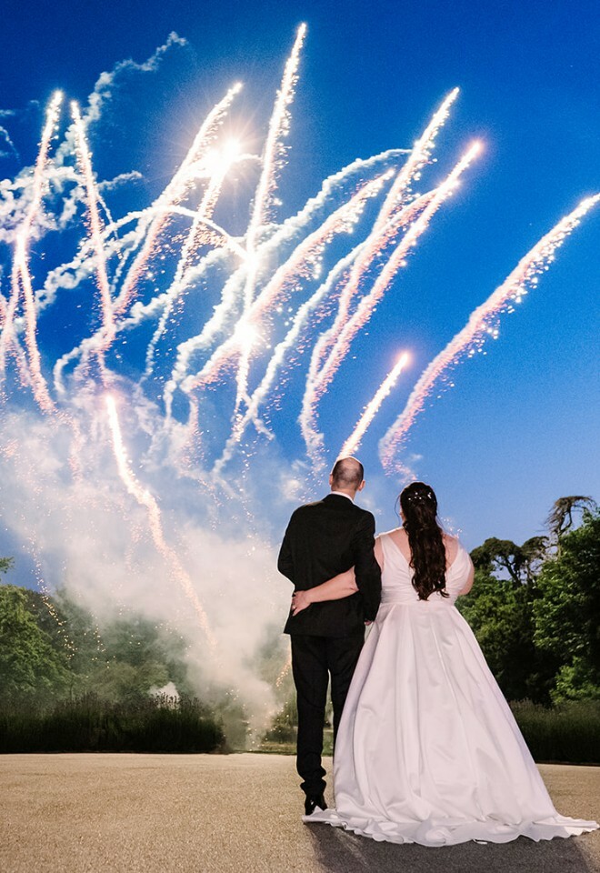 Alison and Martyn watching fireworks at their wedding at Clevedon Hall