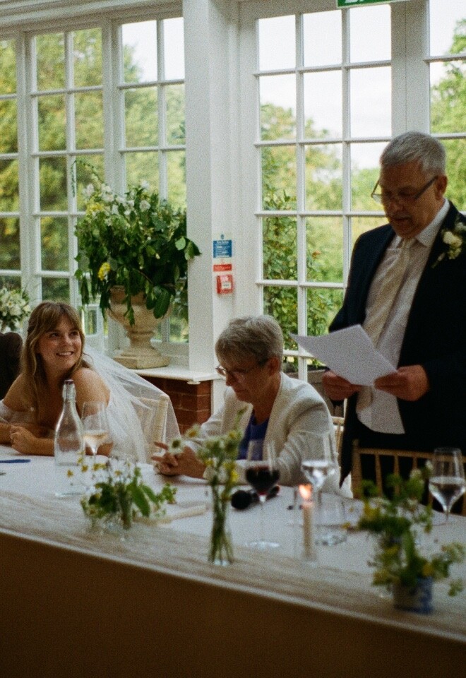 Speeches being delivered at wedding reception