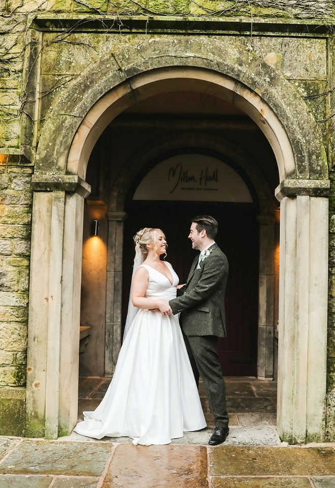 Bride and groom outside of Mitton Hall