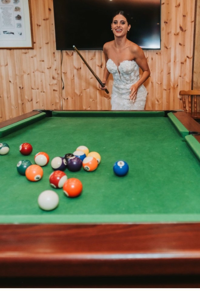 Bride playing pool