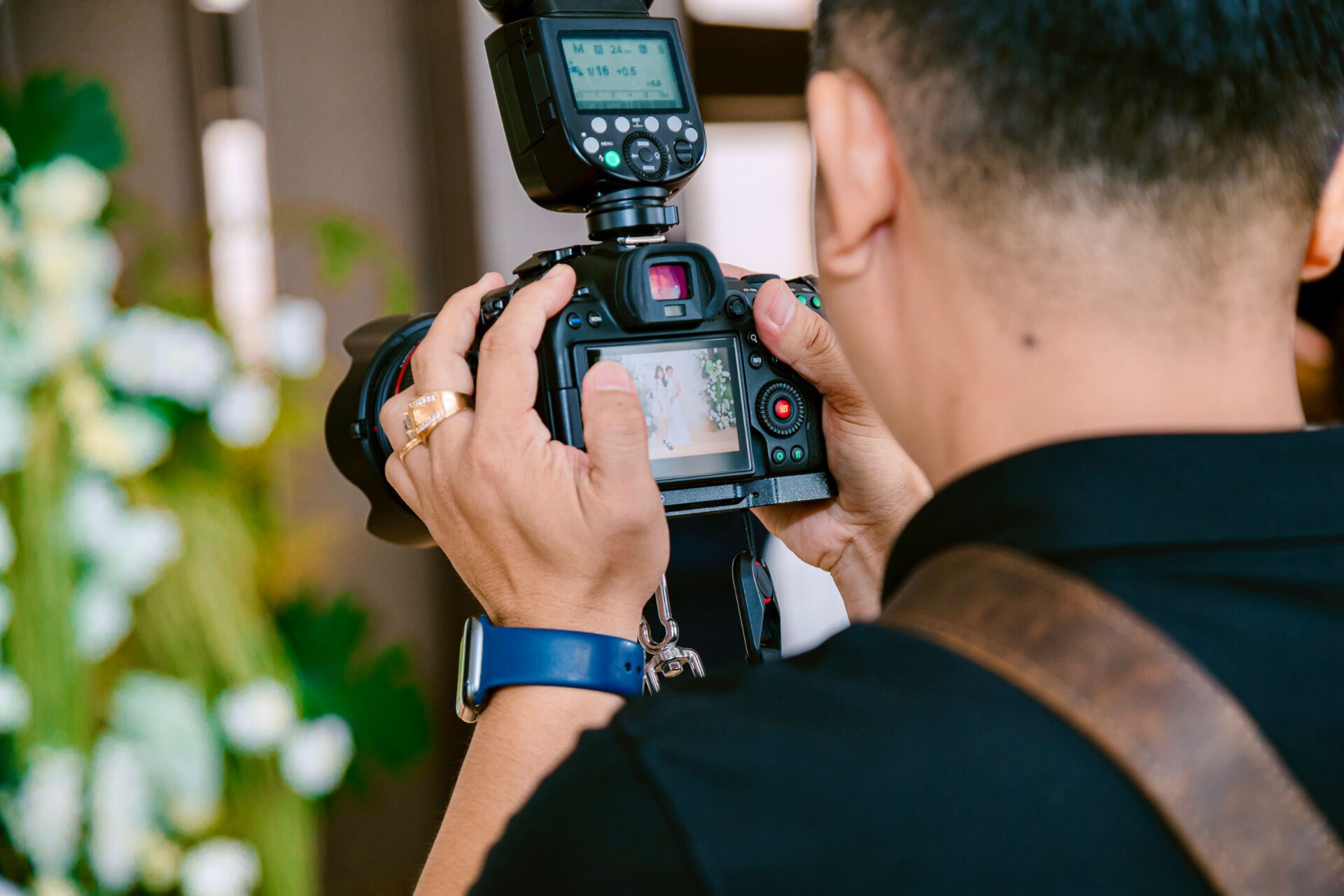 Wedding photographer capturing images of a couple during their wedding day