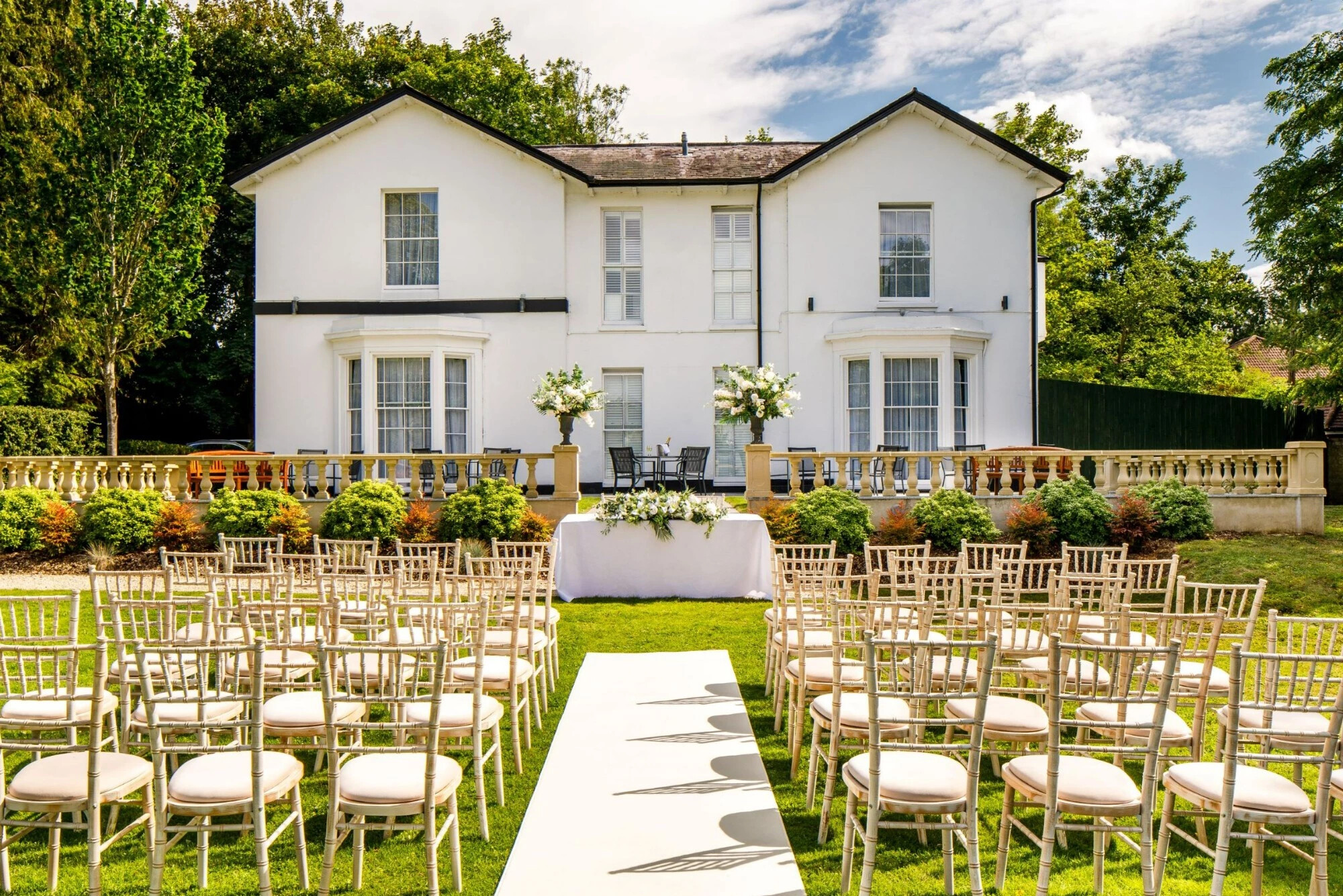 Outdoor wedding ceremony in the gardens of Hawkwell House, Oxford