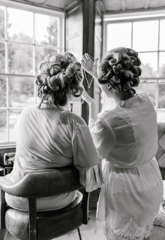 Bride shows bridesmaid gift