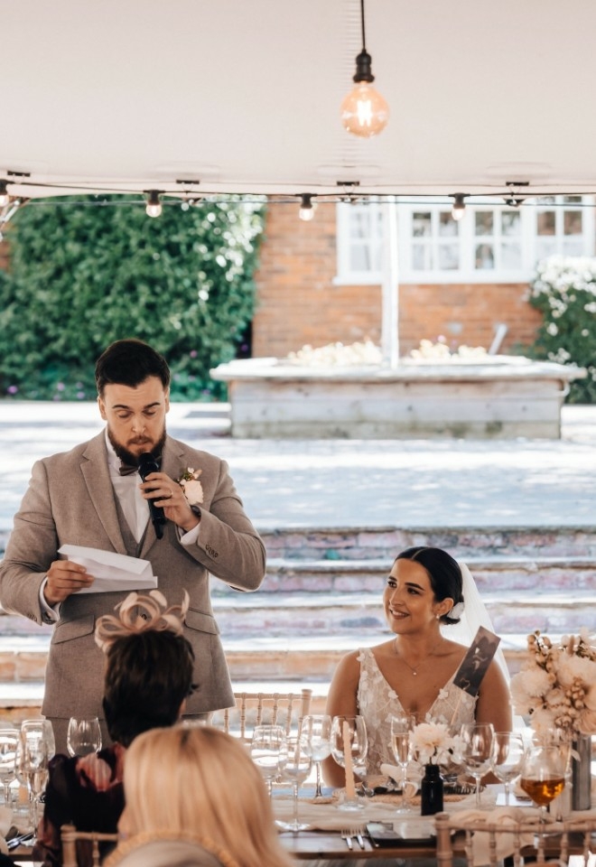 Nathan giving a toast speech at the wedding
