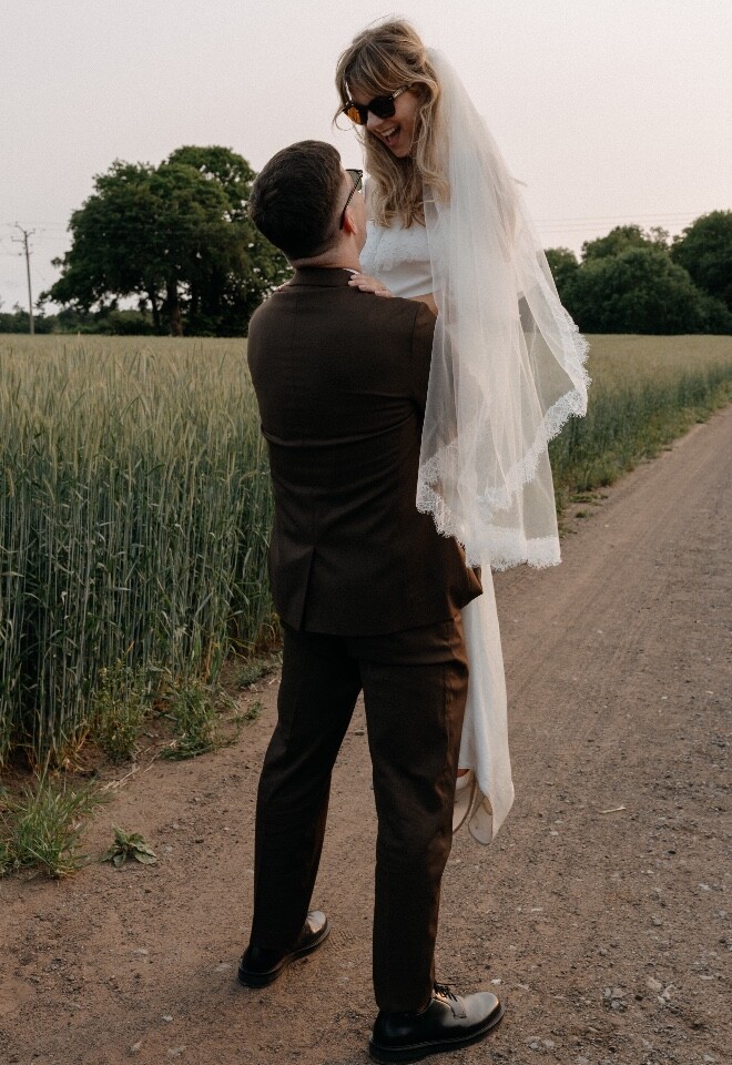 Groom lifting bride