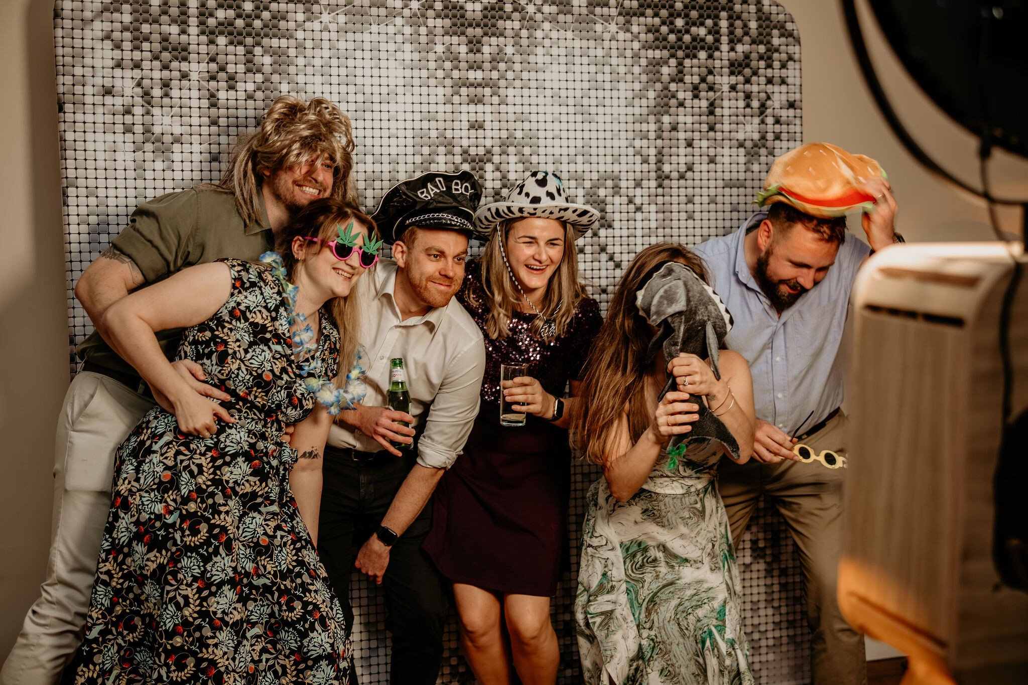 Guests gather in front of Photo Booth at a wedding