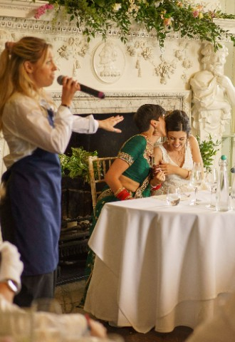 Ana and Satveer being sung to by Tailors Surprise Singers