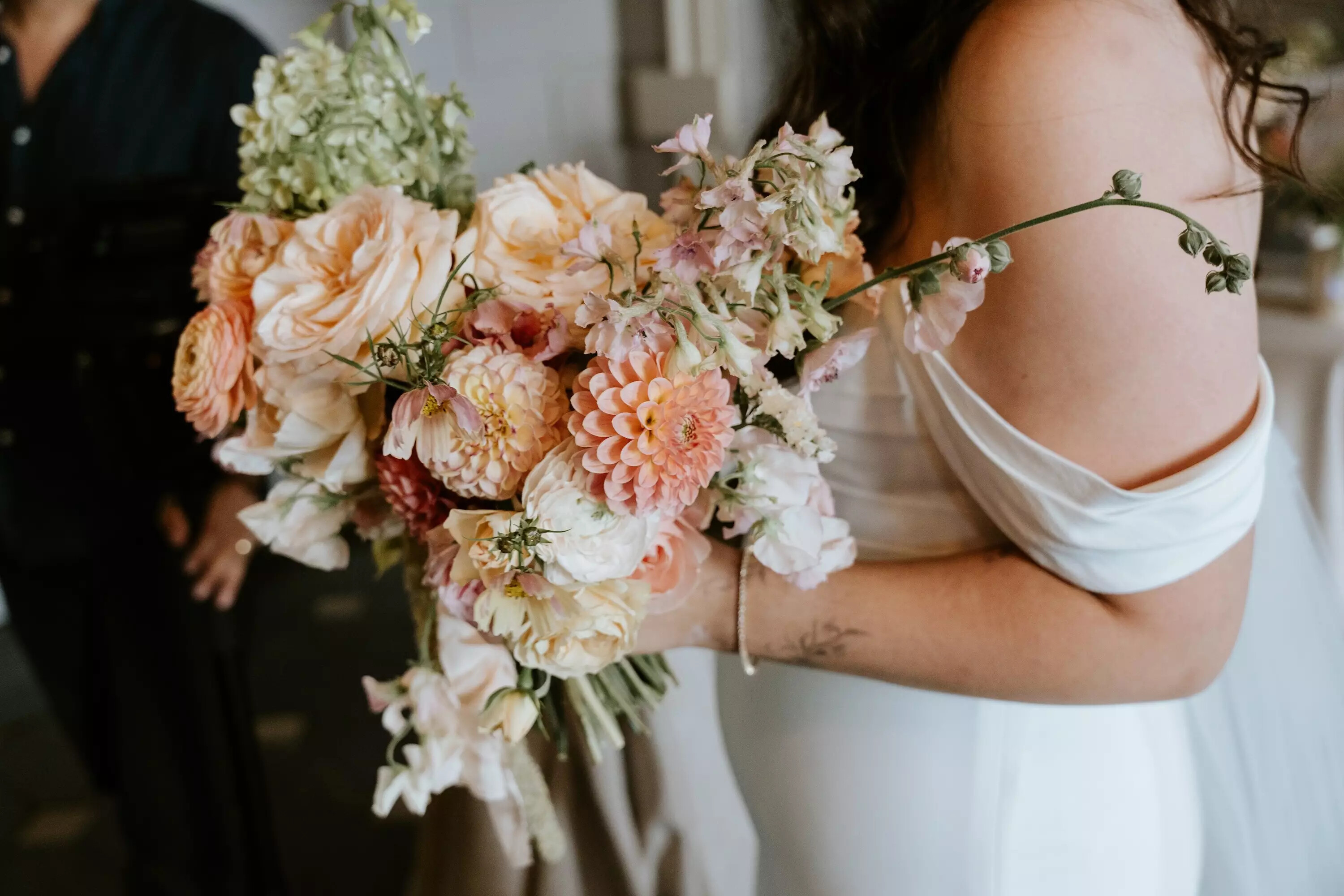 Bride holds her bridal bouquet before walking down the aisle