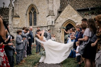 Bride and groom infront of church in Ardington