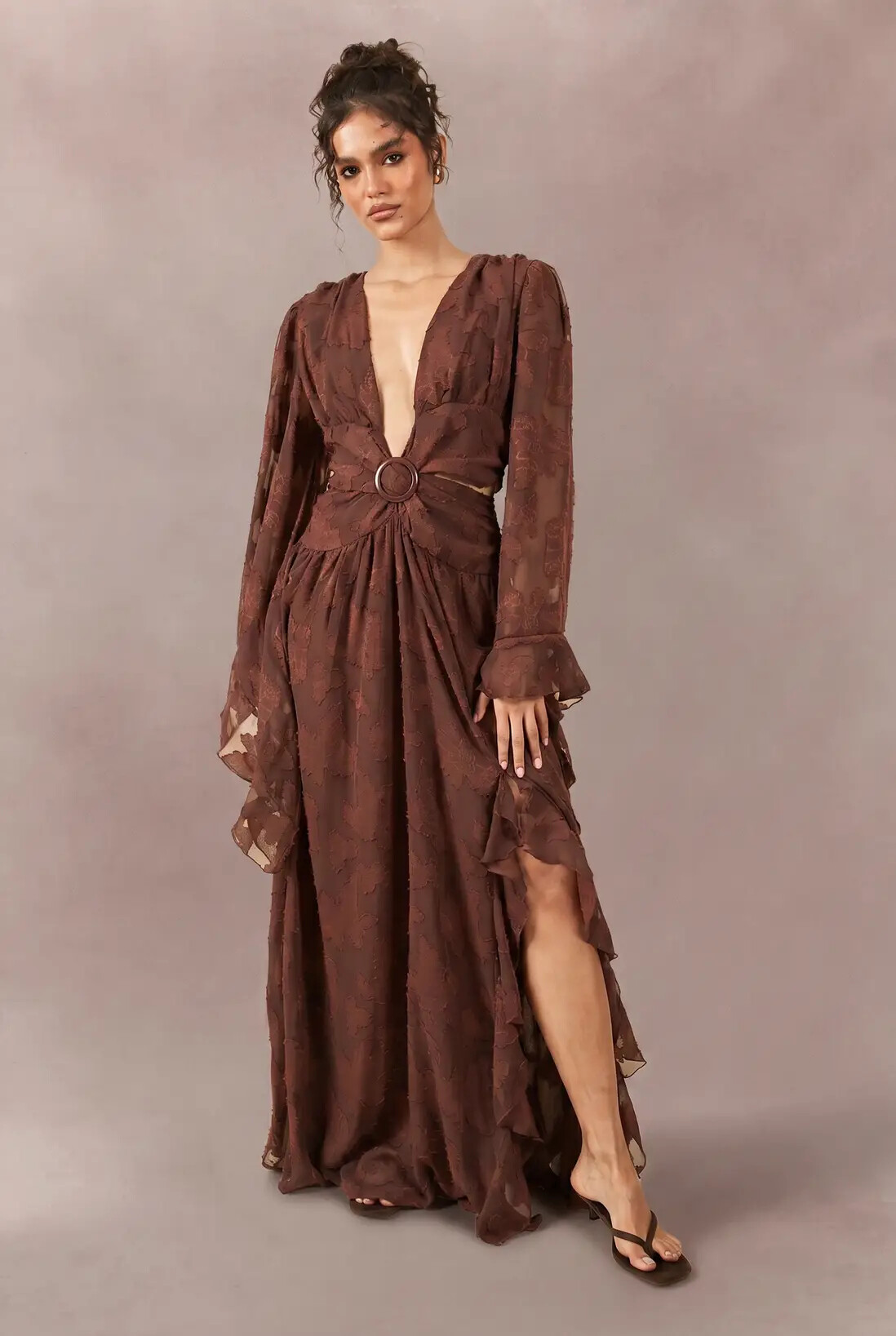 model wearing long sleeved brown detailed dress