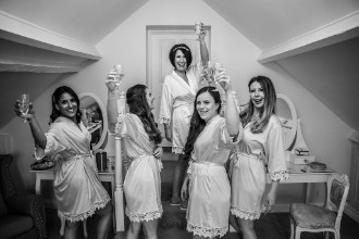 bride and bridesmaids getting ready b&w