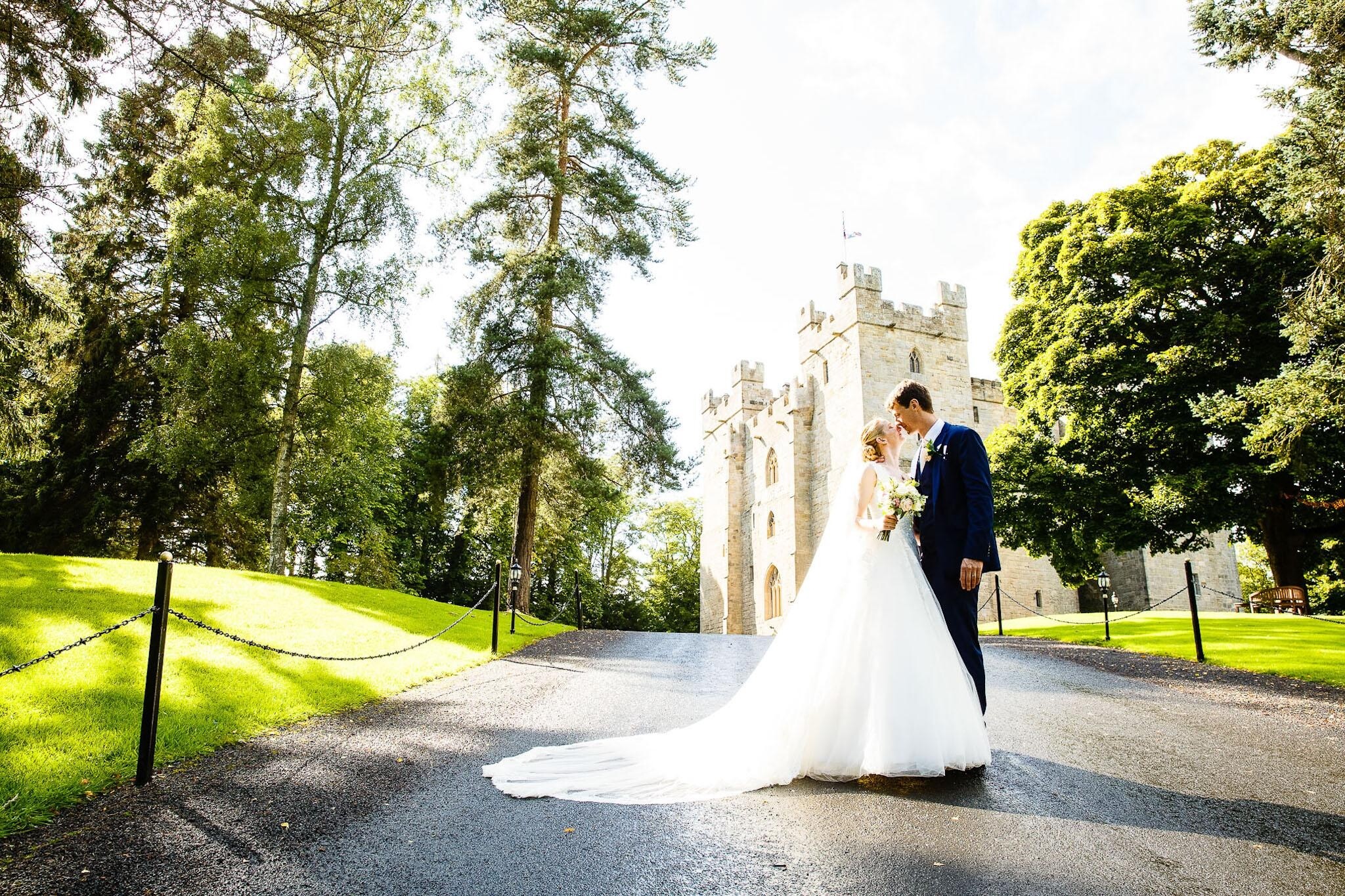 Newlyweds kissing outside Langley Castle wedding venue