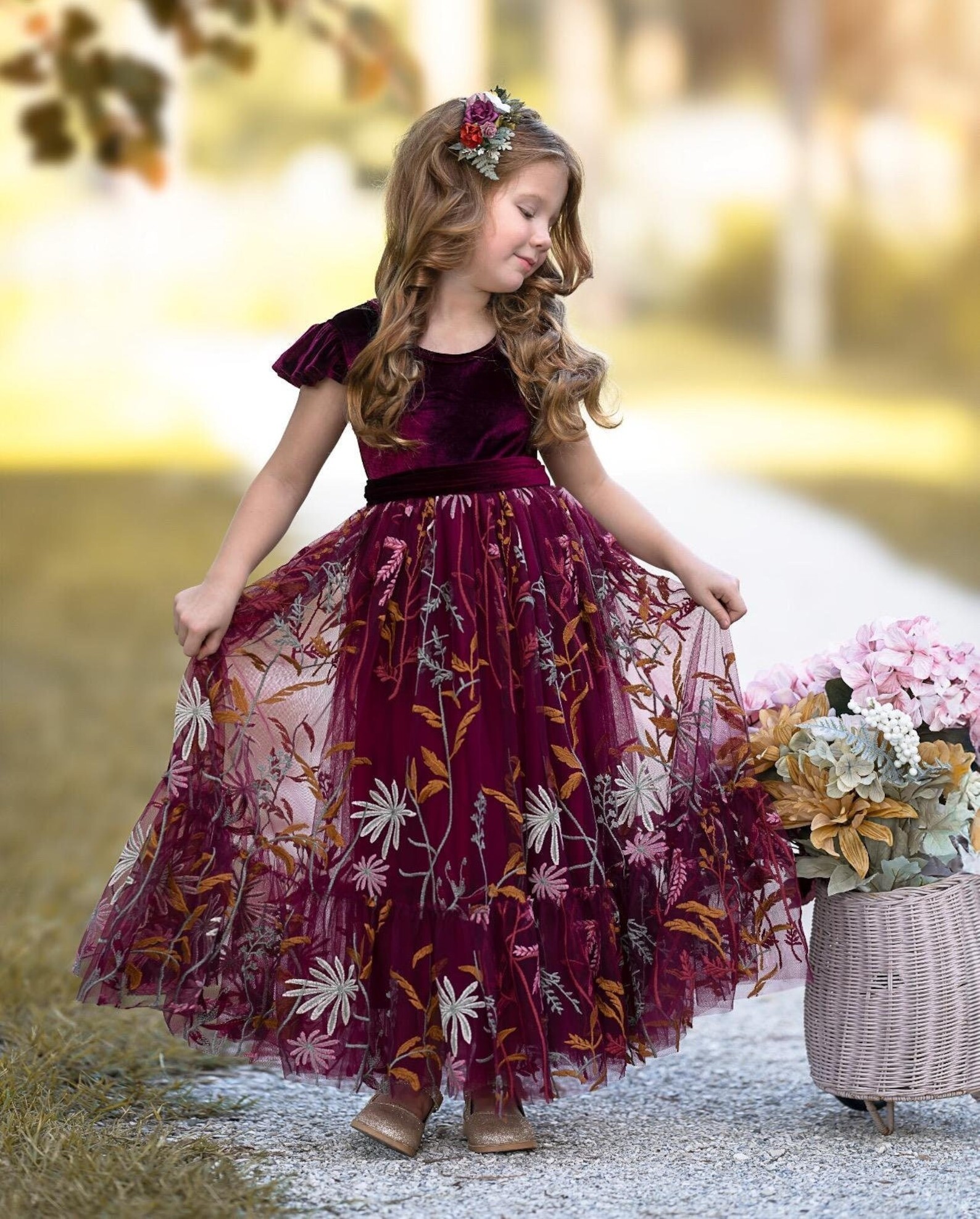 young girl in burgandy velvet maxi dress with floral embroidered flowers on mesh detail