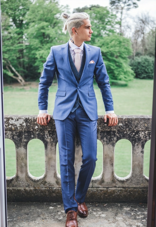 Groom on balcony at Chateau Vary styled shoot