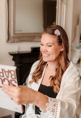 Bride seeing make up for the first time at Southdowns Manor wedding venue