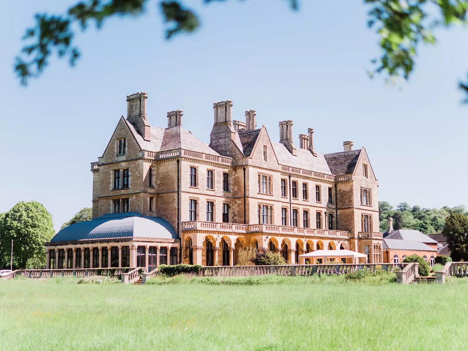 Exterior view of Walton Hall wedding venue set within countryside grounds in Warwickshire.