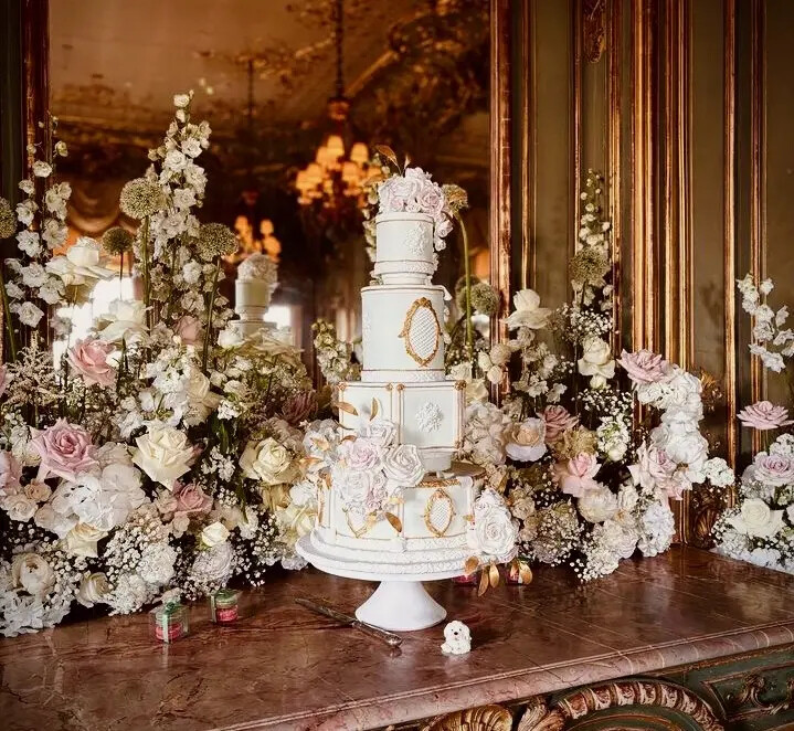 4-tier wedding cake with different shape layers and fresh florals - created by Hall of Cakes