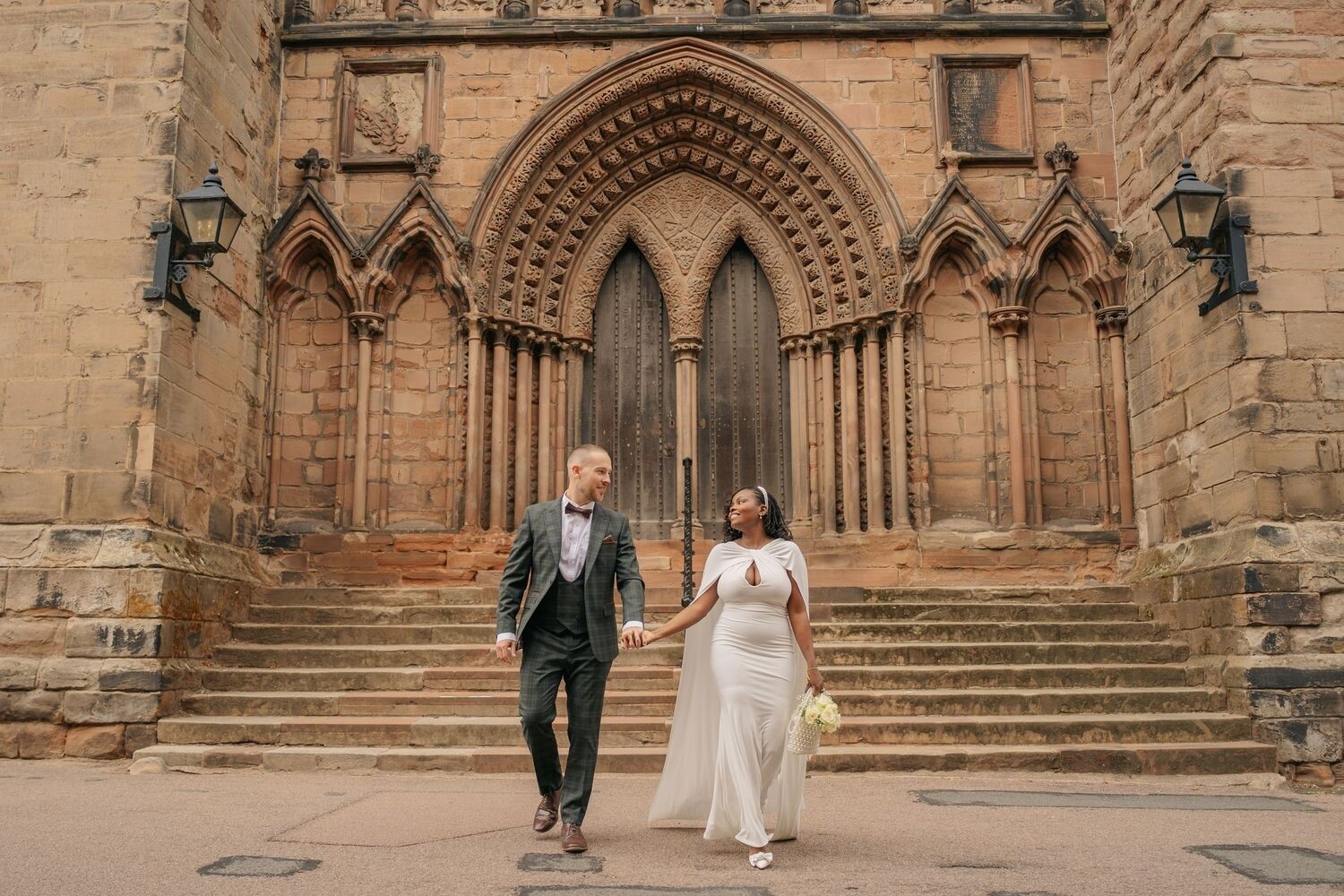 Wedding couple photo outside of a historic venue, taken by Jemma Lane Photography, Warwickshire
