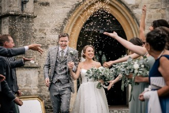 Bride and Groom exiting church in Ardington