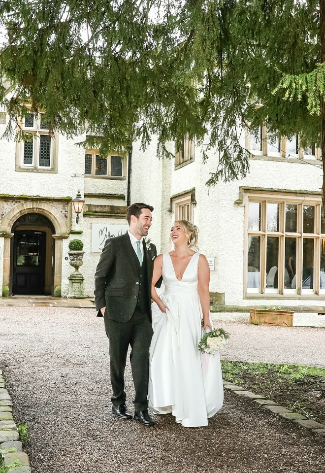 Bride and groom outside of Mitton Hall