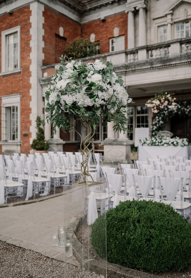 White wedding decor and flowers for ceremony
