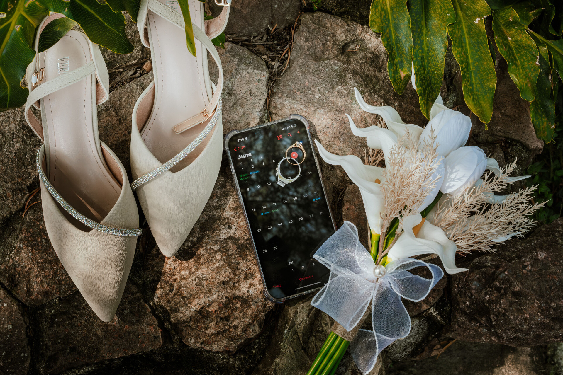 Wedding detail shot of wedding rings, shoes, bouquet, and AI wedding coordinator platform