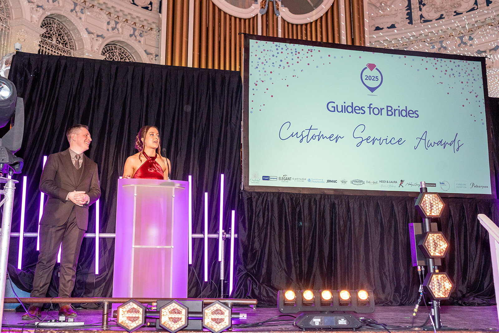 Nikita Thorne and John Maddaford from Guides for Brides hosting the Customer Service Awards 2025
