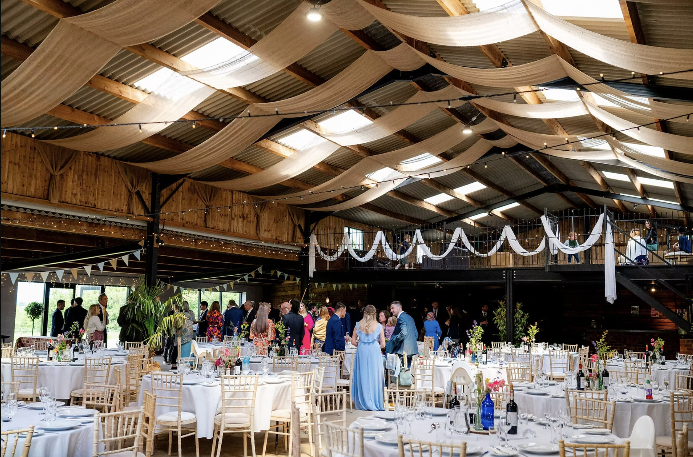 the tractor barn wedding venue northamptonshire with wooden interior wedding breakfast