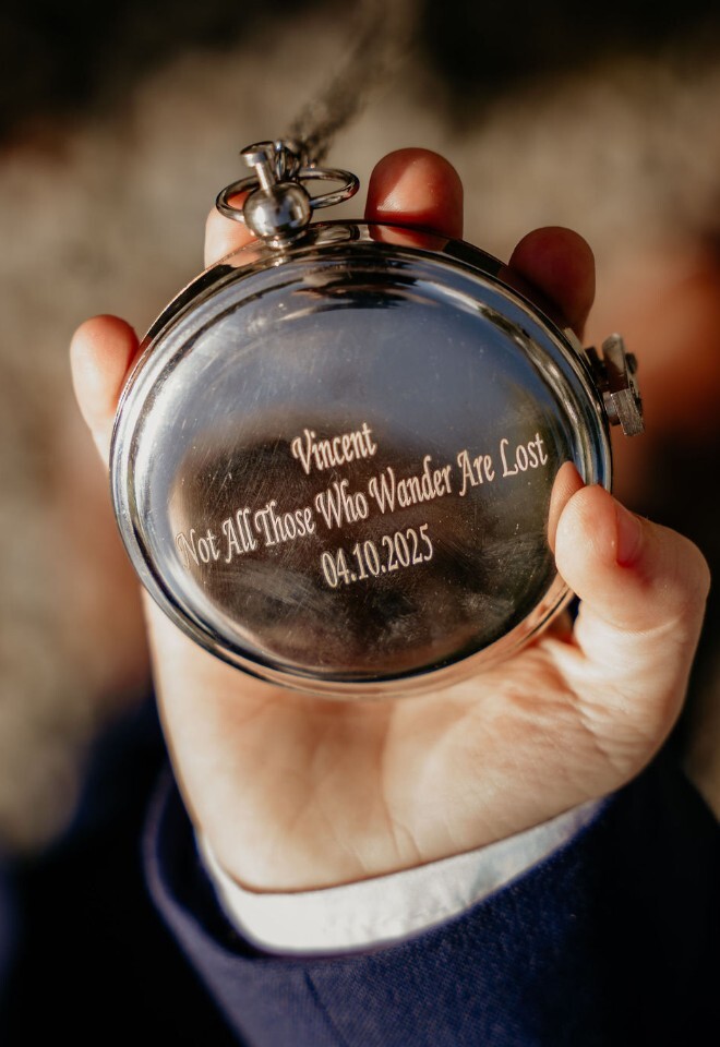 Personalised engraved compass gift for the ring bearer held in hand