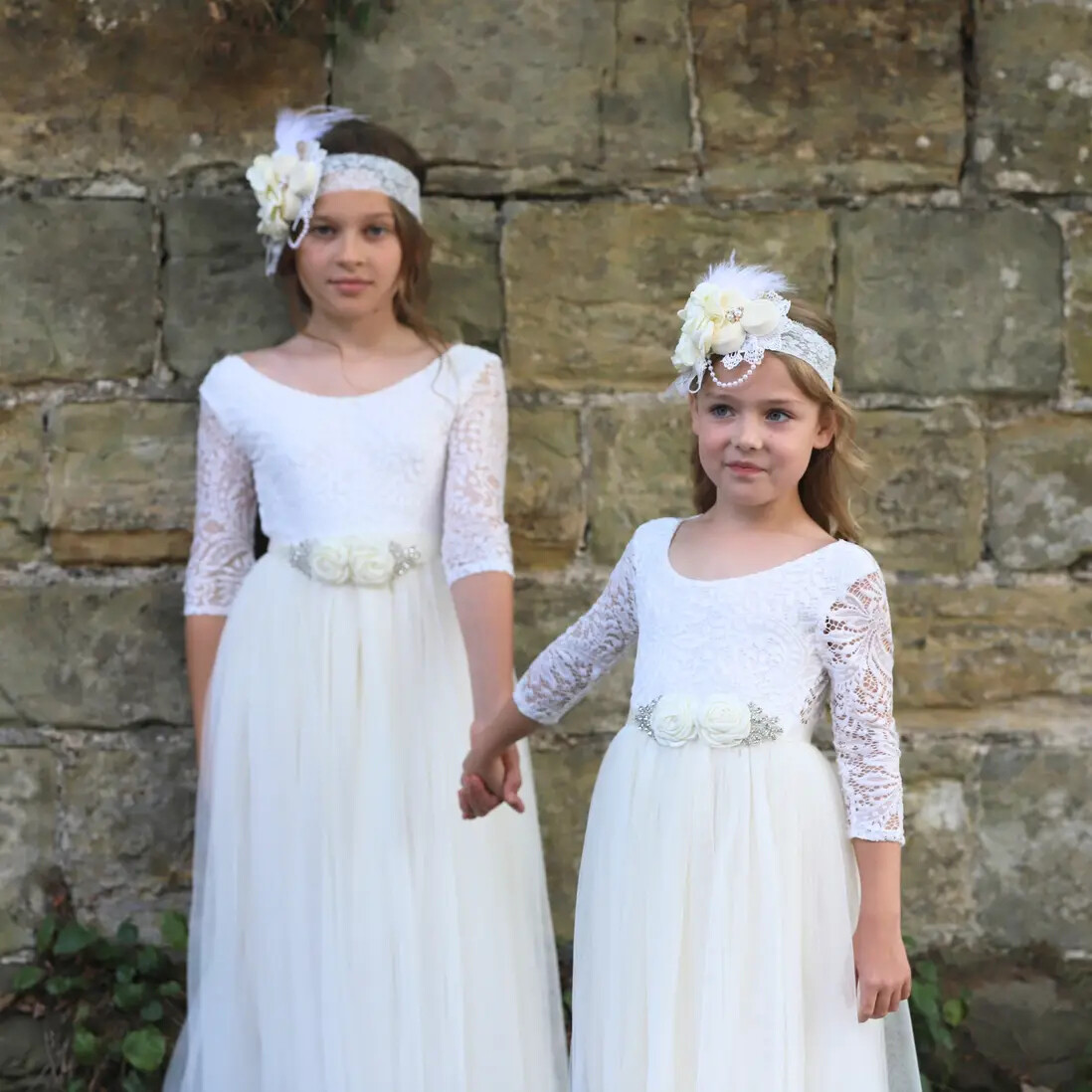 Flower girls with long sleeve, cream dresses on