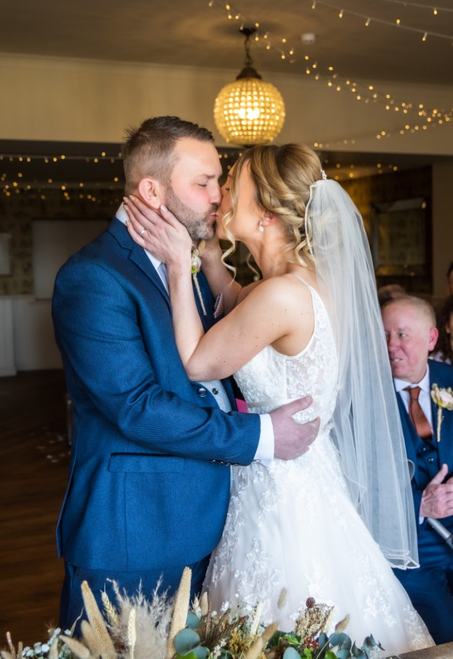 bride and groom kissing at their ceremony at Shireburn Arms
