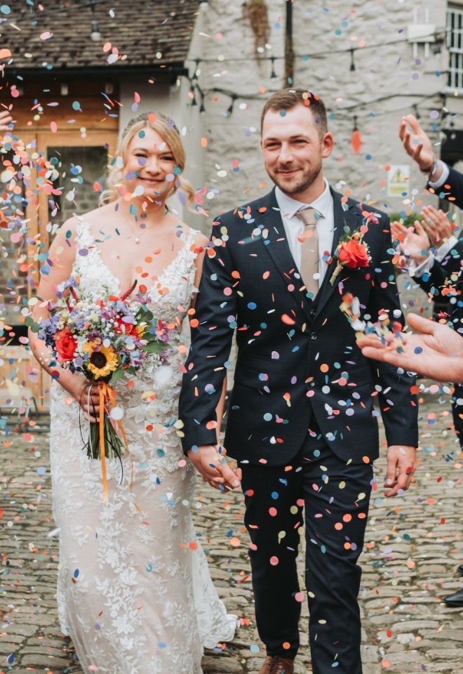 Rosie and Kyle celebrating their wedding